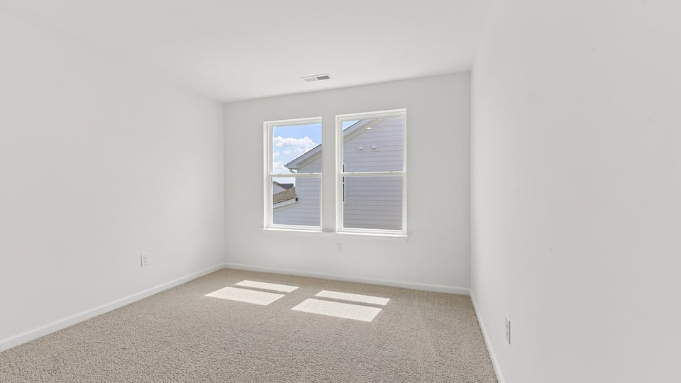 additional bedroom with window, carpeting, closet