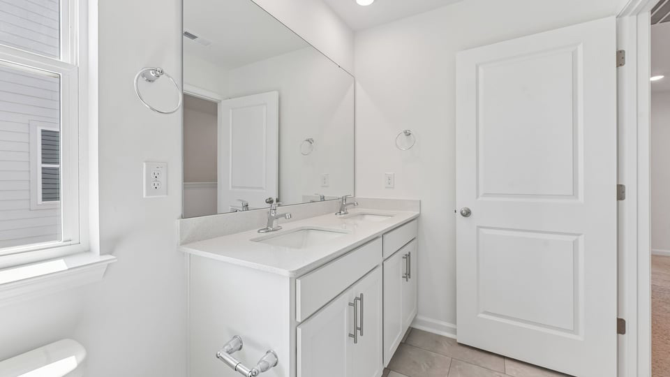 additional bathroom with double vanity sink