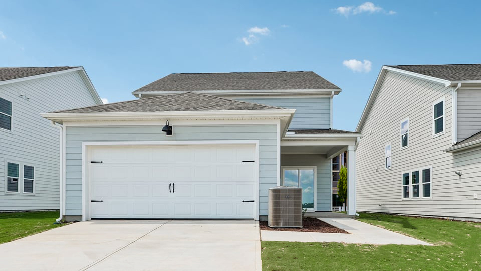 exterior covered patio with driveway & garage