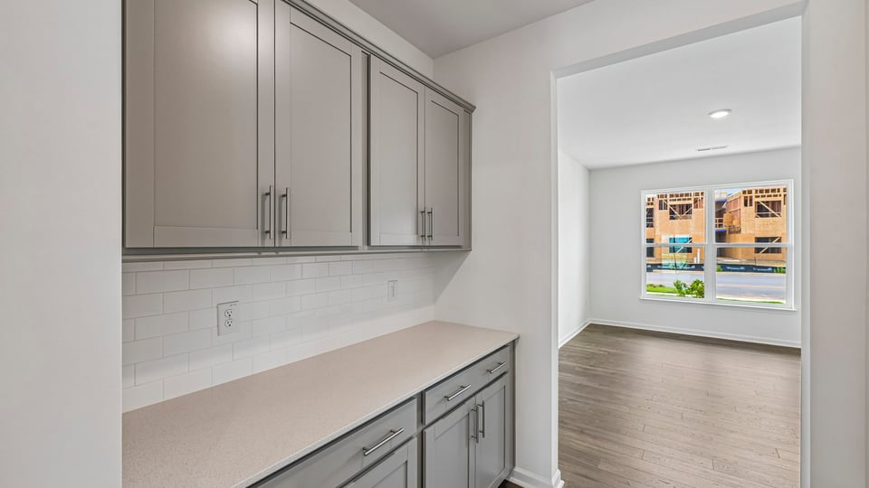 butlers pantry with quartz countertop