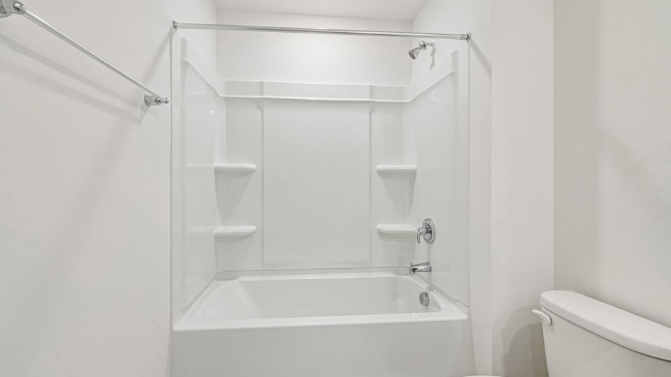 bathroom with tub shower combo