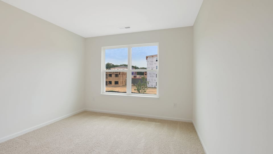 secondary bedroom with carpet flooring