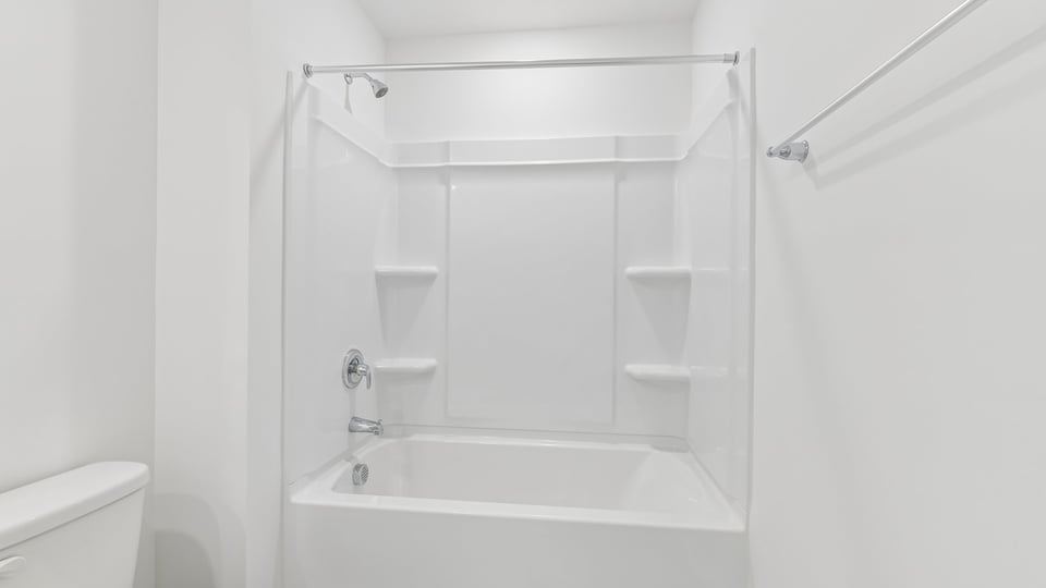 bathroom with tub shower combo