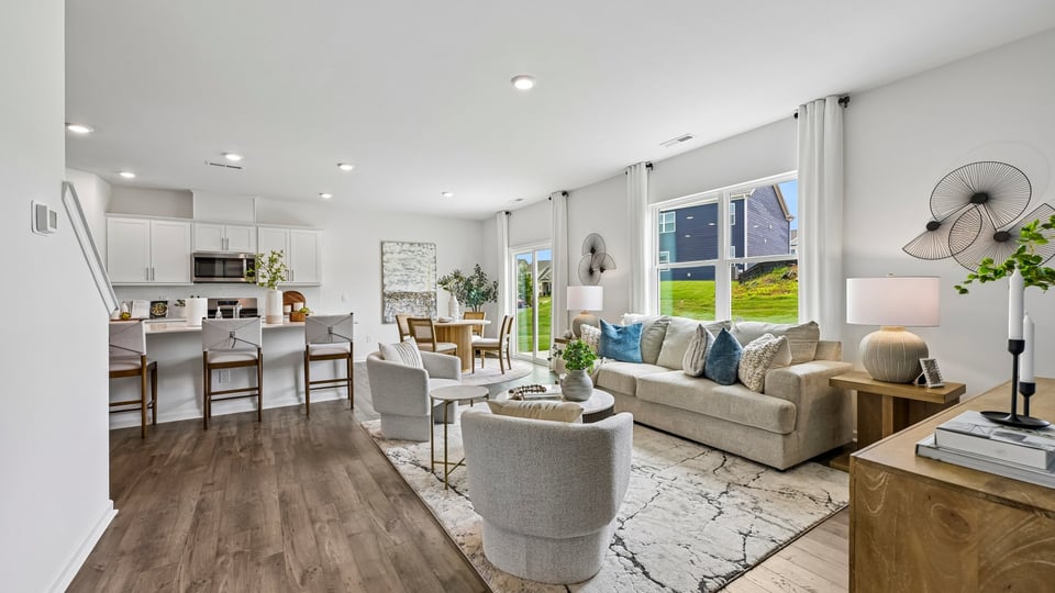 open concept living room overlooked by ktichen