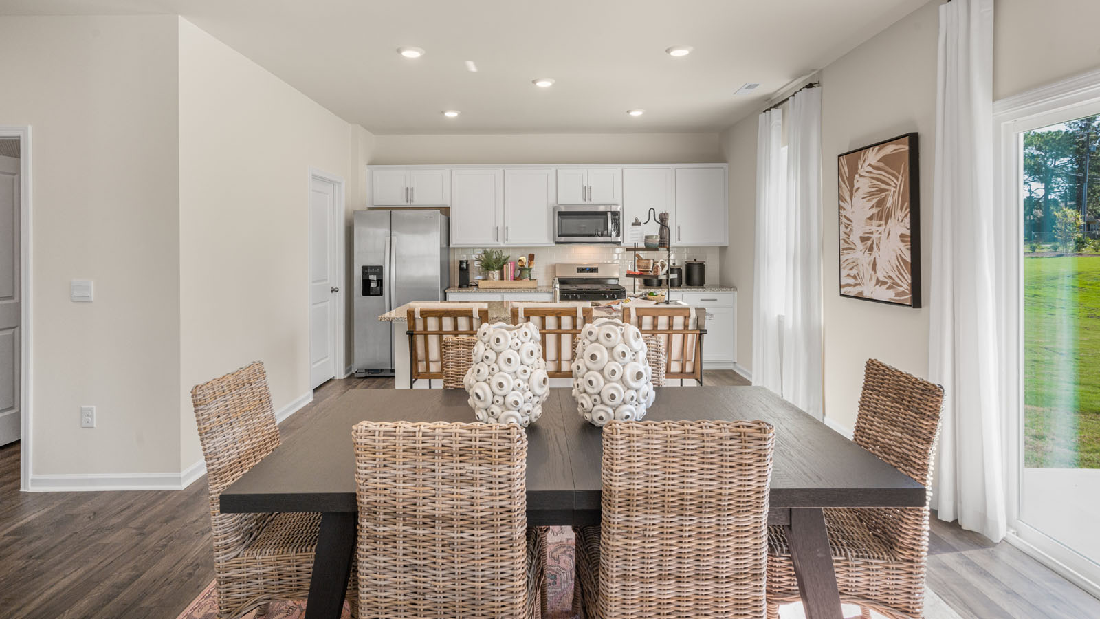 kitchen overlooking dining room with revwood flooring
