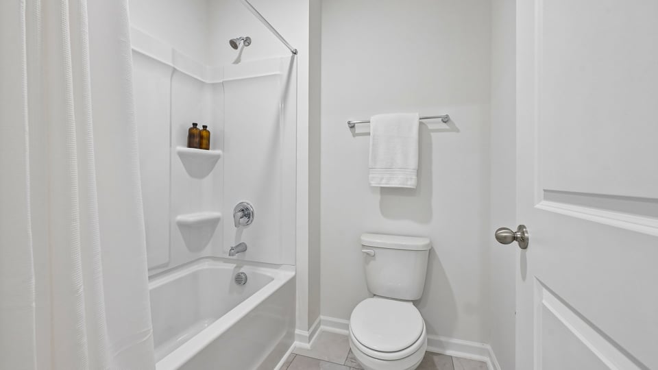 bathroom with tub shower combo