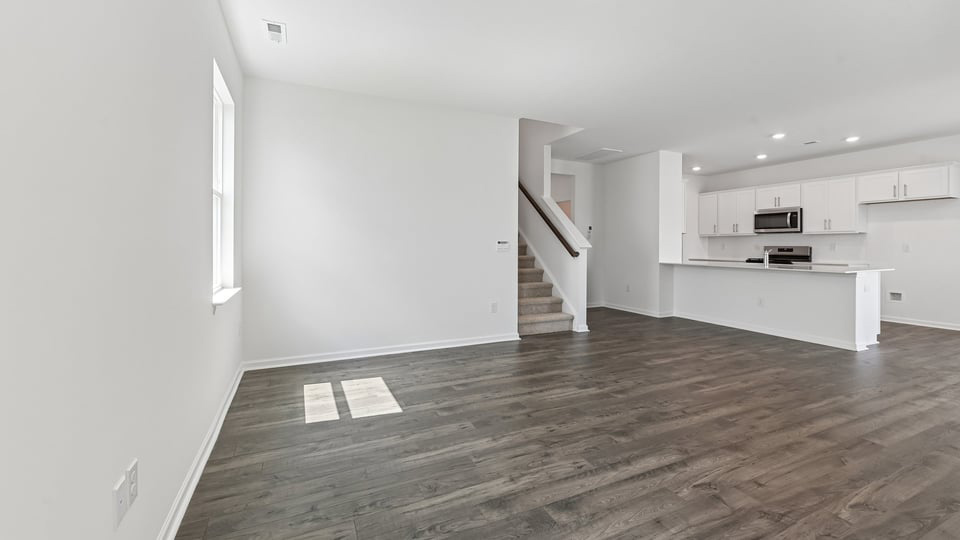 open concept living space with large windows