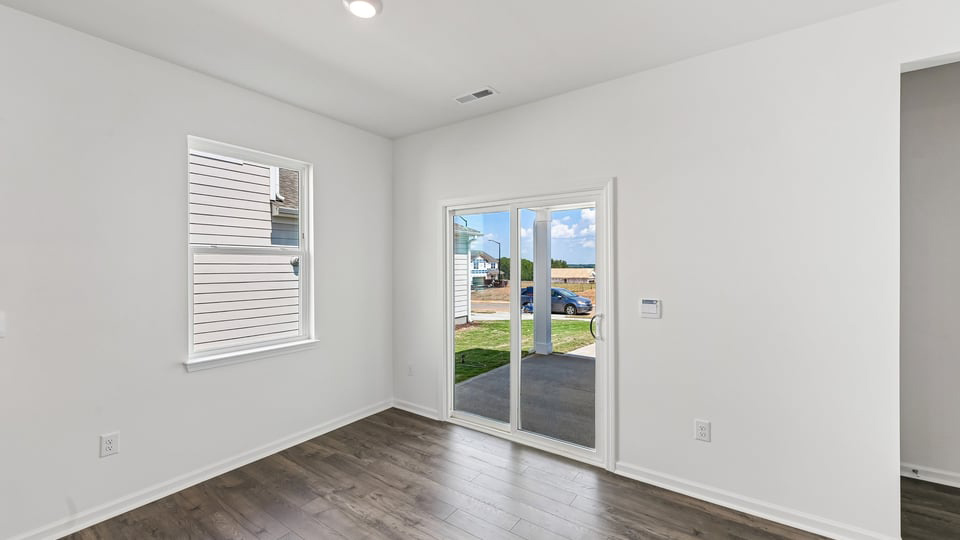 open concept dining space with sliding glass door to patio