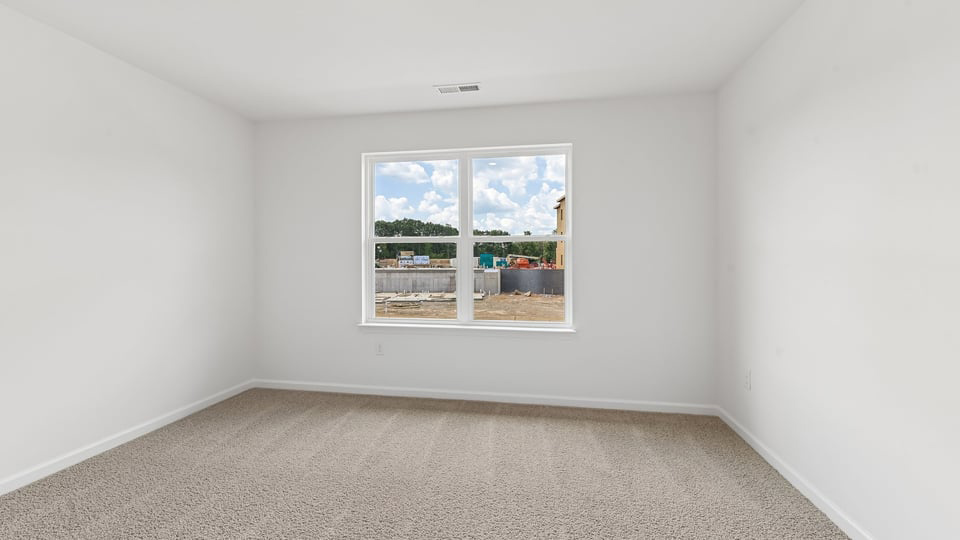 additional bedroom with window, carpeting, closet