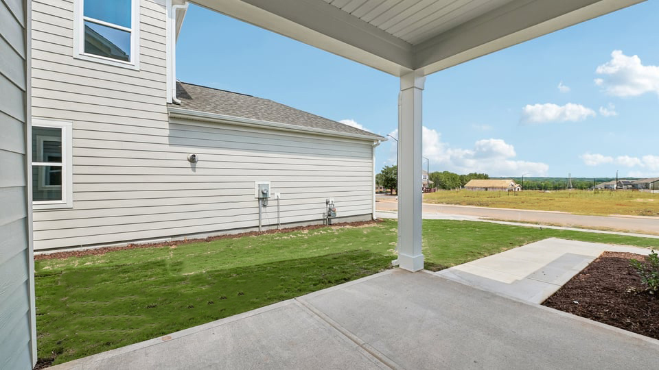 exterior covered patio with driveway & garage