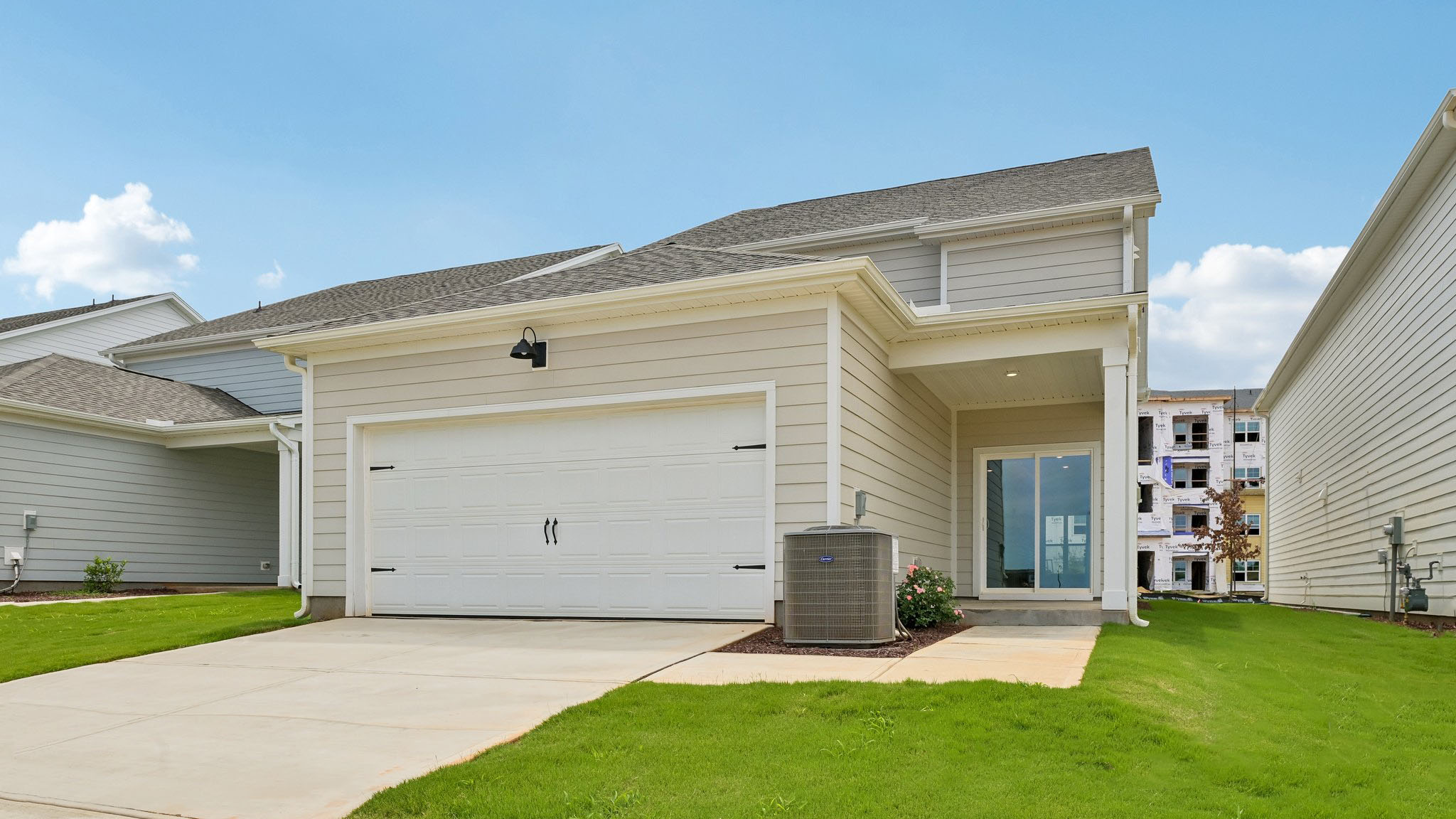 REAR EXTERIOR AND REAR-LOAD GARAGE DOOR