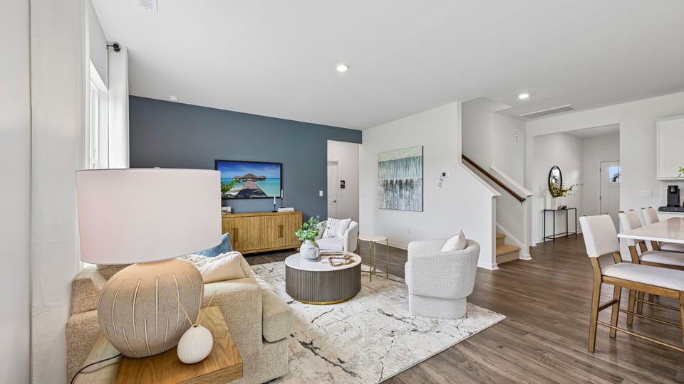 open concept living room overlooked by ktichen
