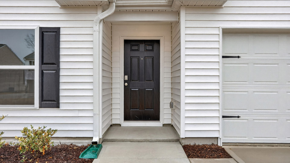 front exterior door of cali with small stoop