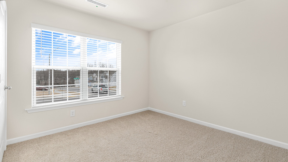 additional bedroom with window, carpeting, closet