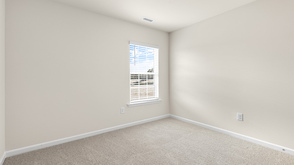 additional bedroom with window, carpeting, closet