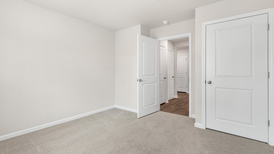 additional bedroom with window, carpeting, closet