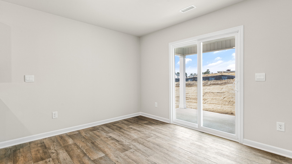 open concept dining space with door to patio