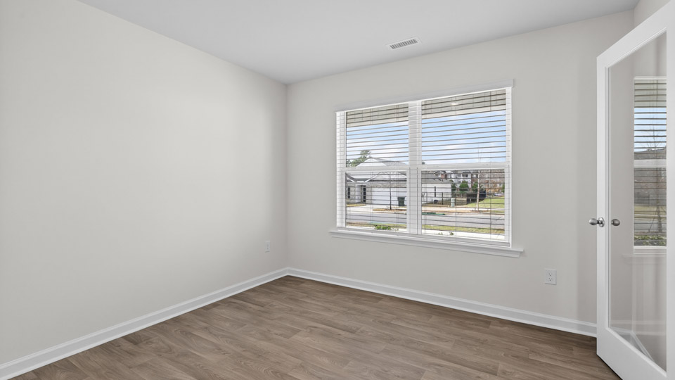 Study room with hardwood floors and big windows