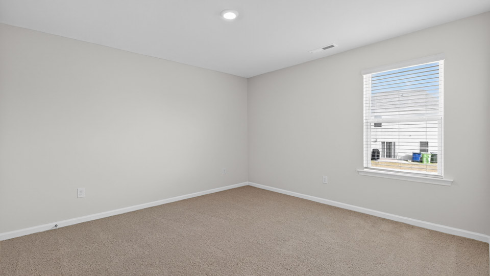 Bedroom with carpet floor and window
