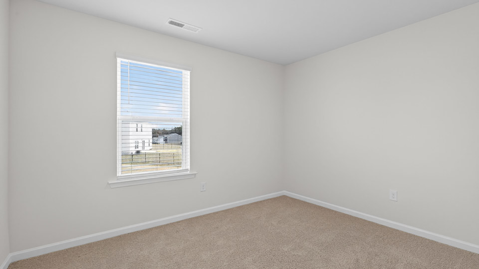 Bedroom with carpet floor and window
