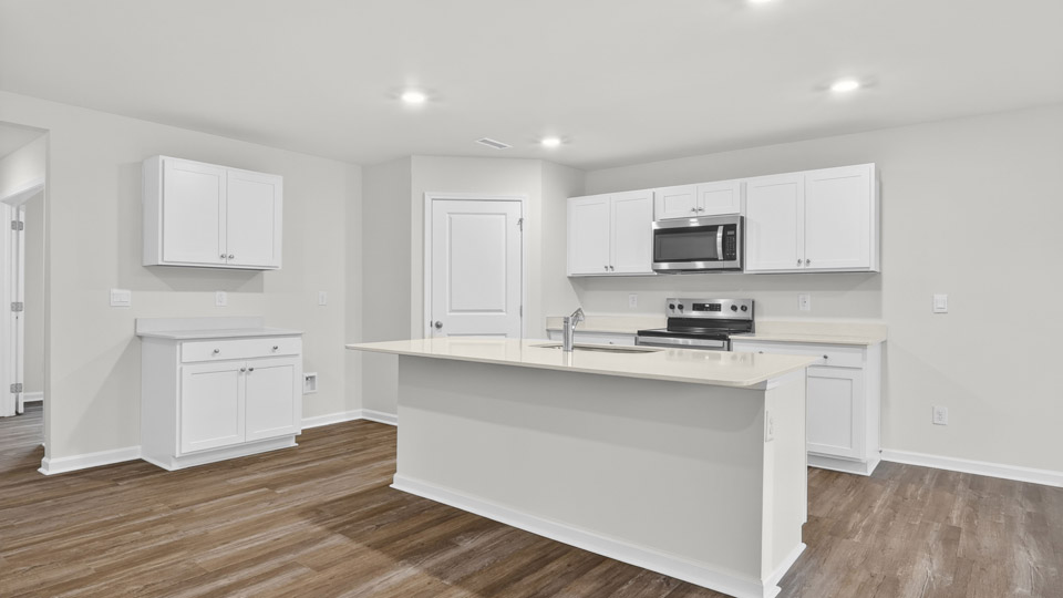 kitchen with white cabinets and quartz countertops