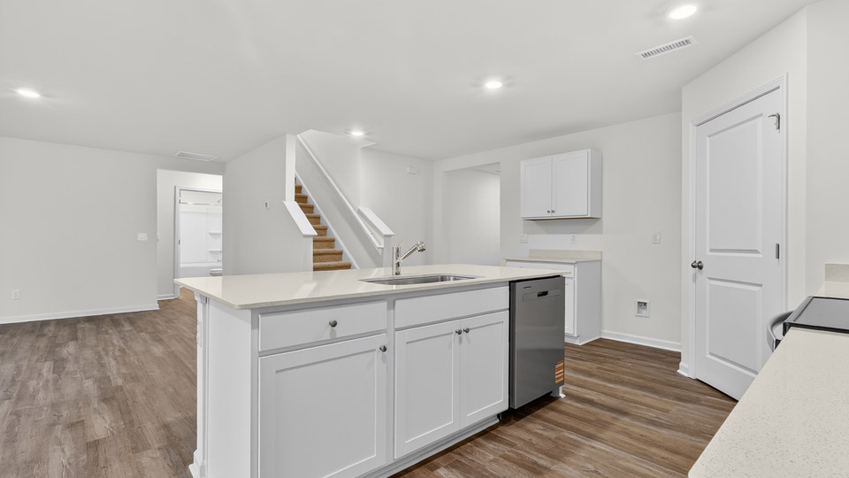 kitchen with white cabinets and quartz countertops