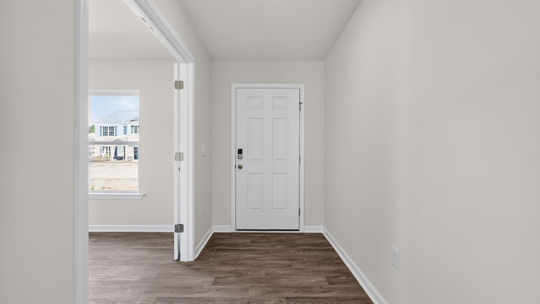 foyer entryway with revwood flooring