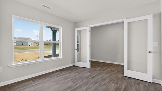 study with revwood flooring and french glass doors