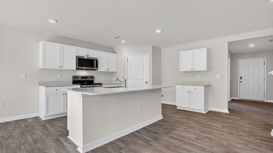 kitchen with island white cabinets and quartz countertops