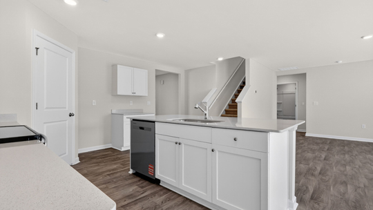 kitchen island with quartz countertops and under cabinet storage