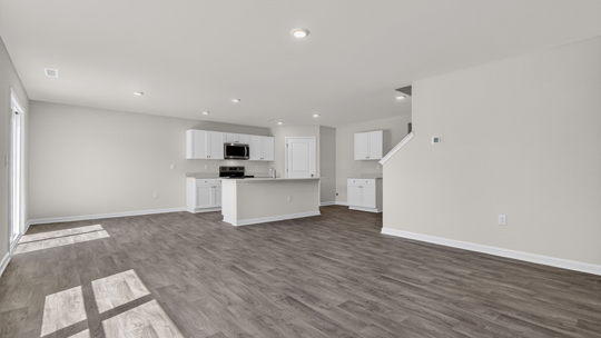 open concept layout with kitchen overlooking licing room