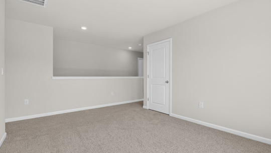 loft with carpet flooring