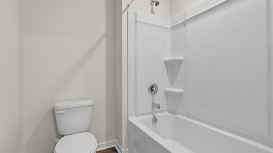 bathroom with tub shower combo