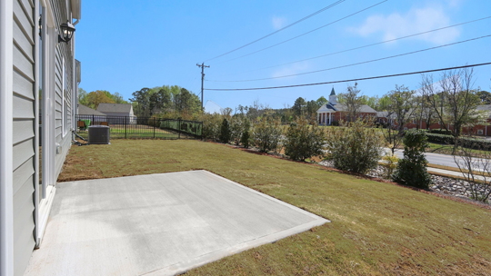 concrete patio and backyard