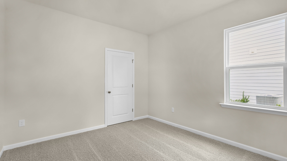 additional bedroom with window, carpeting, closet