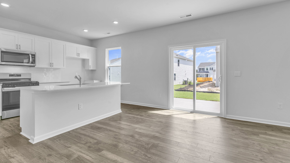 kitchen with quartz countertops and sliding glass doors