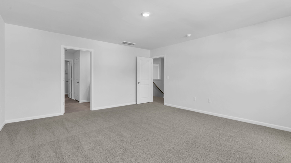 loft with carpet flooring