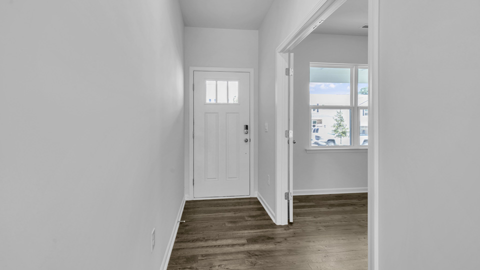 foyer entryway with revwood flooring