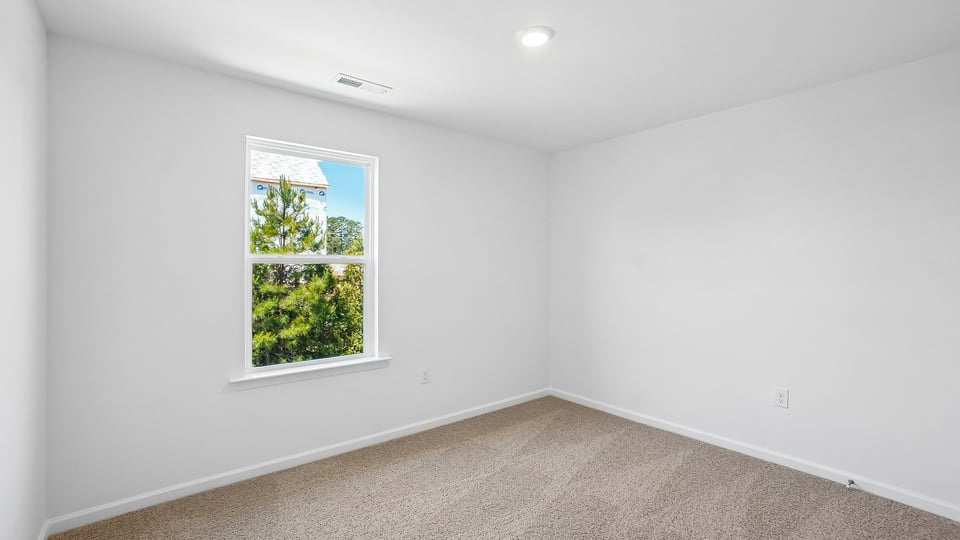 additional bedroom with window, carpeting, closet