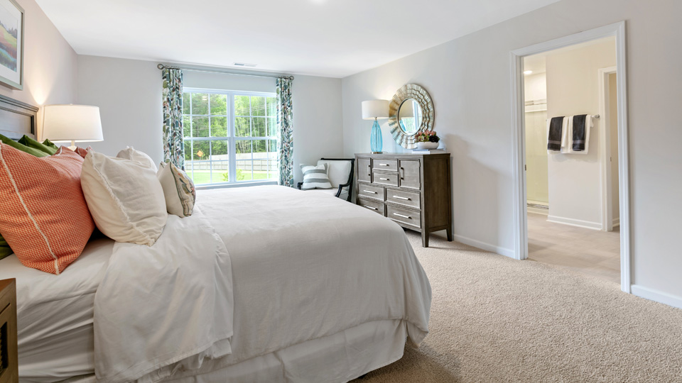 Primary bedroom with carpet flooring