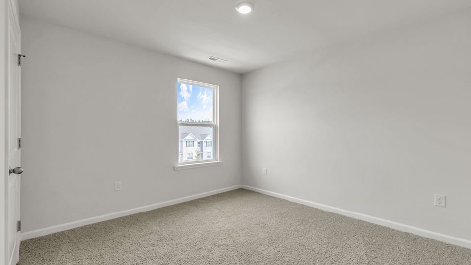 additional bedroom with window, carpeting, closet