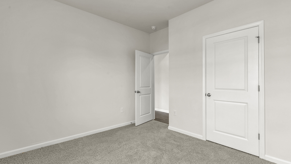 additional bedroom with window, carpeting, closet