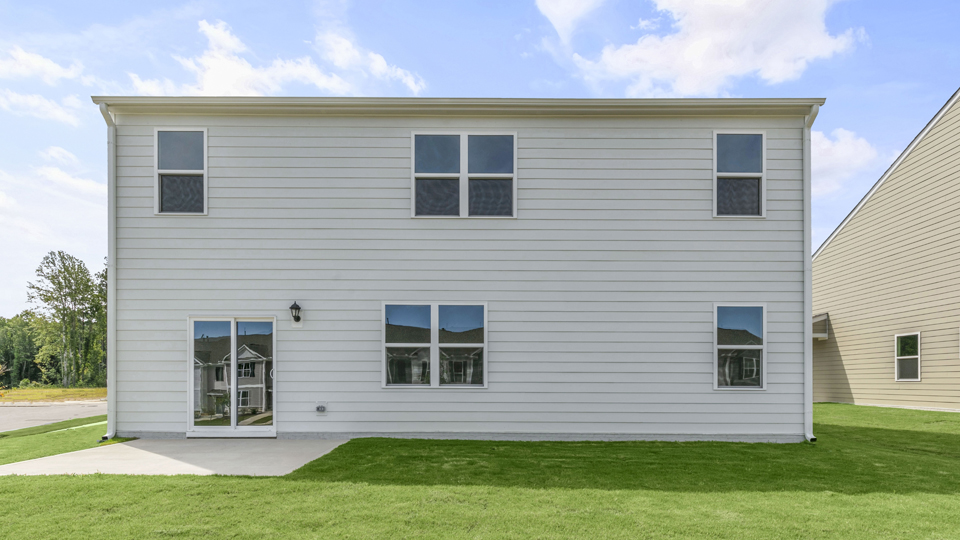 exterior patio with concrete slab and open yard