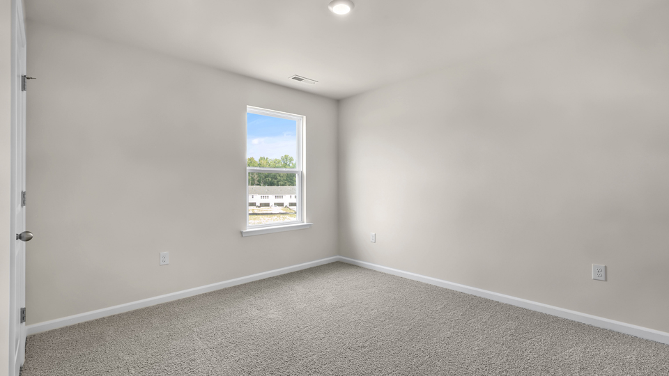 additional bedroom with window, carpeting, closet