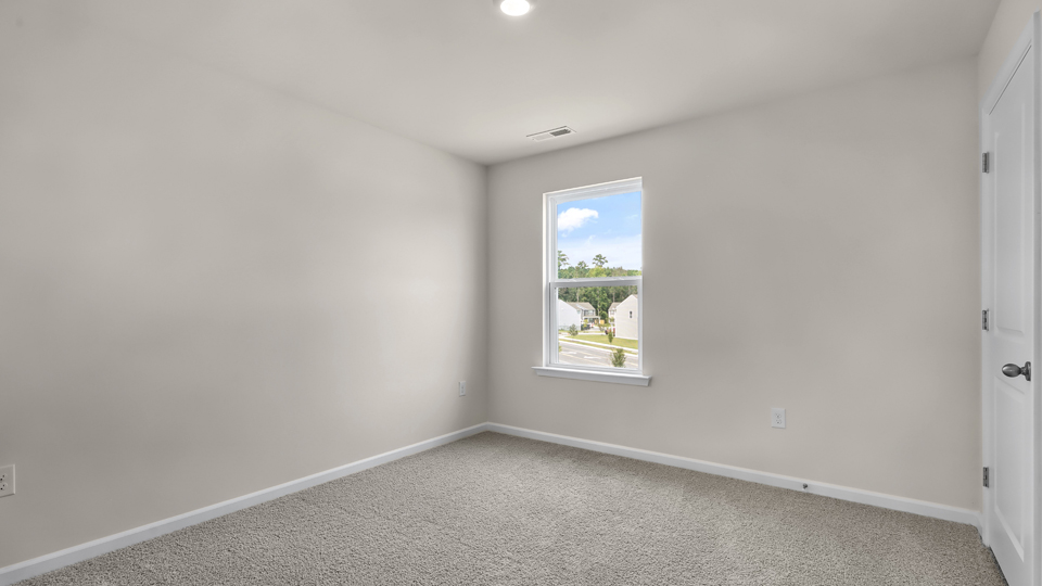 additional bedroom with window, carpeting, closet