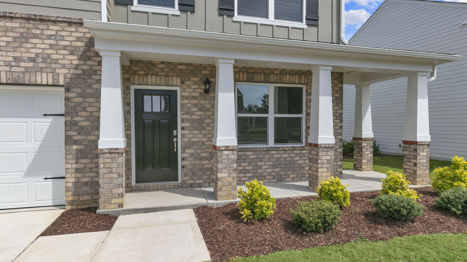 front door of Wilmington B floorplan with covered porch area