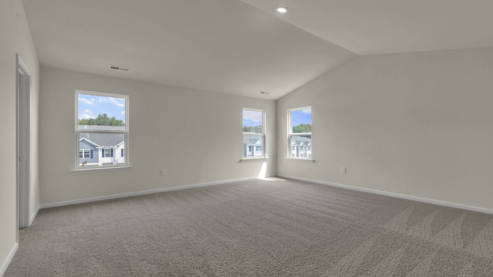 Primary bedroom with carpet flooring