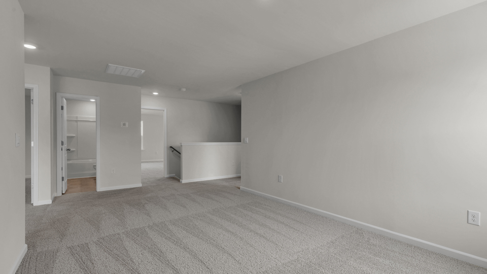 Loft with carpet flooring