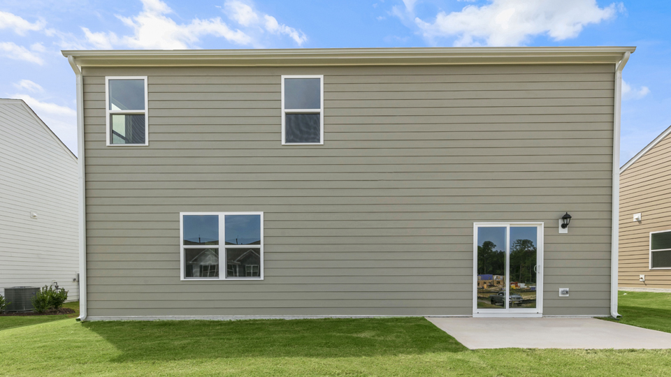 back exterior of wilmington b with patio