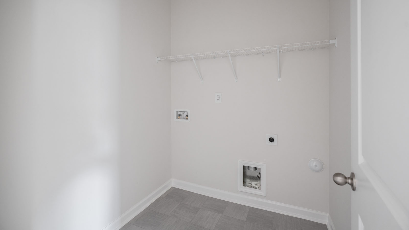 Laundry room with wire shelving